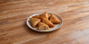 Crispy Moroccan sweet almond triangles glistening with honey