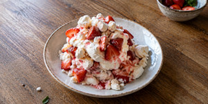 Traditional Eton Mess with strawberries, whipped cream and broken meringue