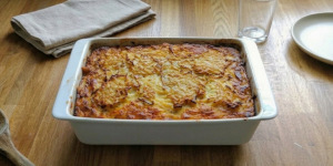 Top view of a freshly baked Lithuanian potato pudding in a ceramic baking dish