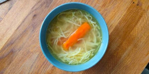 Homemade Polish Rosół soup with vegetables and pasta