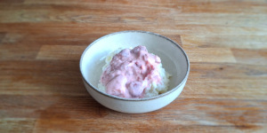 Polish sweet rice cooked in milk, topped with freshly mashed strawberries and sour cream.