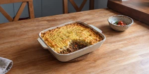 Traditional shepherd's pie with cooked mutton filling and browned mashed potato crust